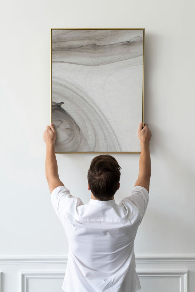 How Experts Hang Pictures Perfectly Straight Every Time