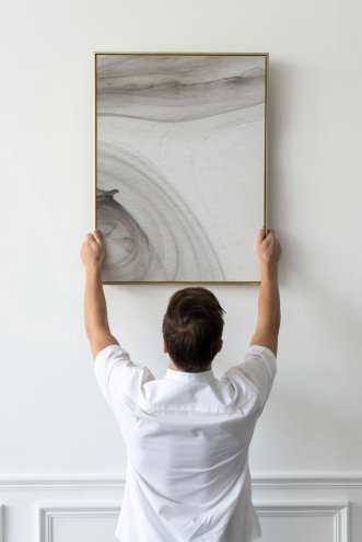 How Experts Hang Pictures Perfectly Straight Every Time